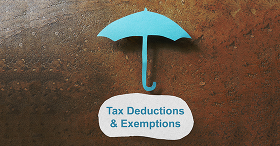 Paper umbrella over a Tax Deduction message